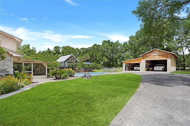 view of yard featuring an outbuilding and a carport