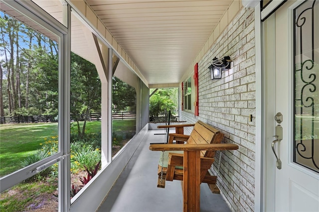 sunroom / solarium featuring a healthy amount of sunlight