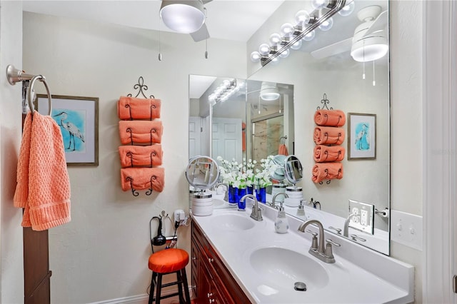 bathroom with vanity and a shower