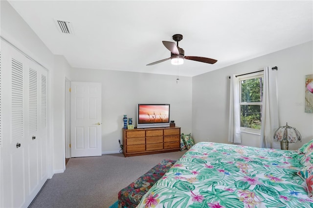 bedroom featuring carpet, ceiling fan, and a closet