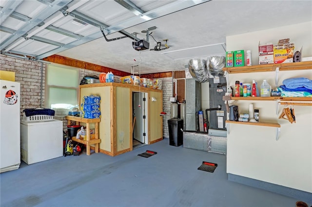 garage with white fridge, refrigerator, and a garage door opener