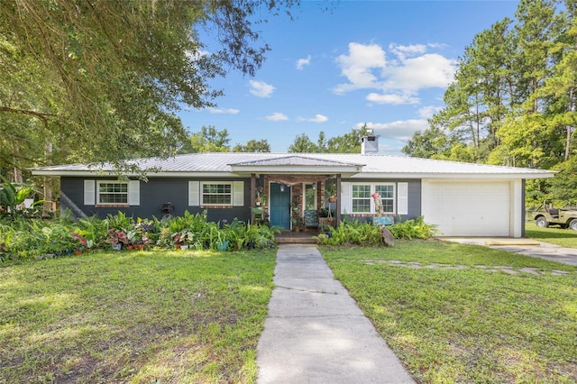 single story home featuring a garage and a front lawn