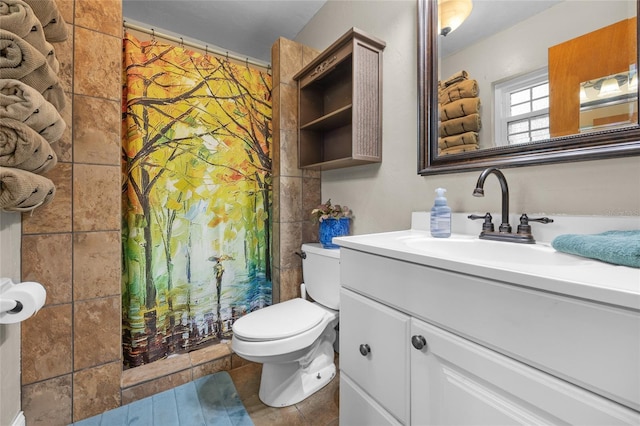 bathroom with vanity, curtained shower, tile patterned floors, and toilet