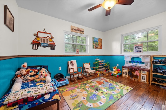 recreation room featuring wood-type flooring and ceiling fan