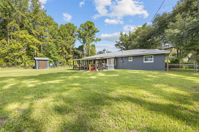 view of yard with a shed and a patio