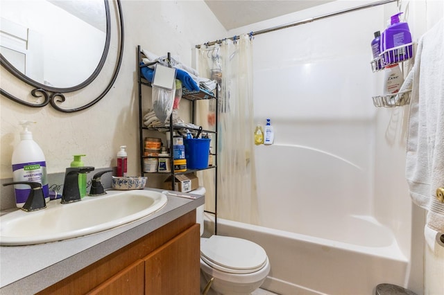 full bathroom featuring vanity, shower / bath combo, and toilet