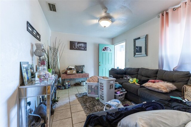 living room with ceiling fan and light tile patterned floors