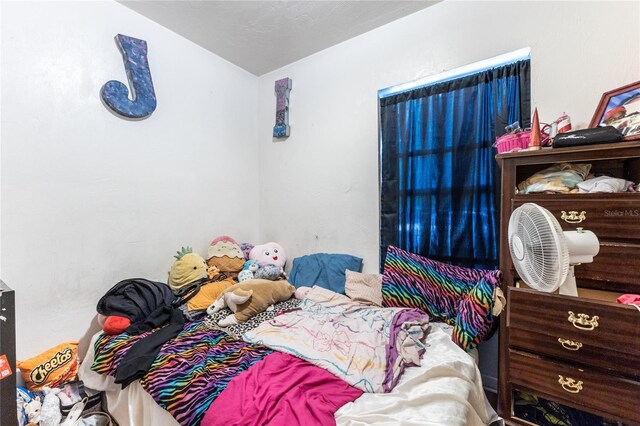 bedroom featuring vaulted ceiling