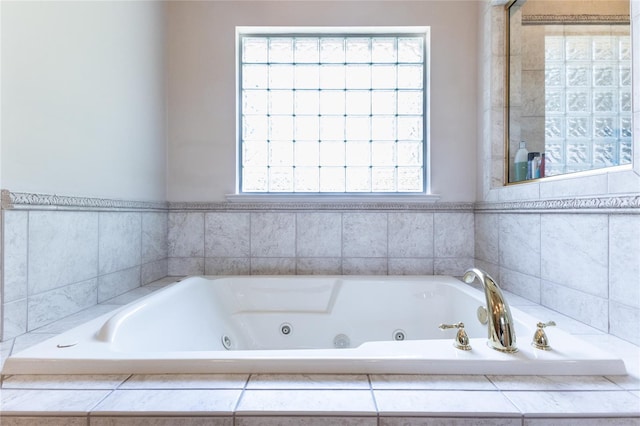 bathroom with tiled tub