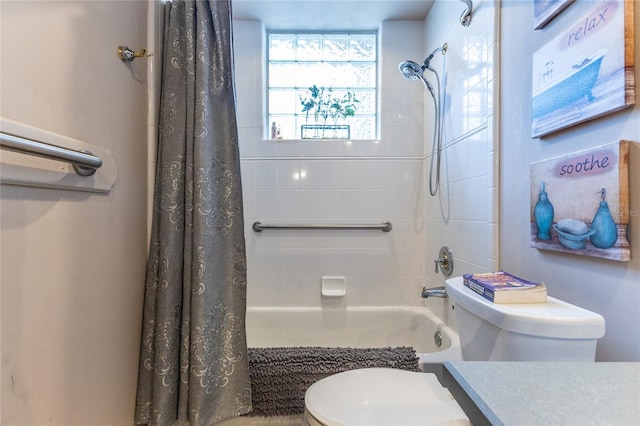 bathroom featuring shower / bath combo and toilet