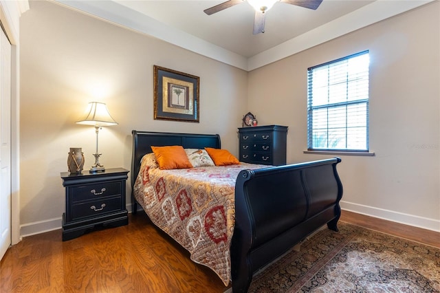 bedroom featuring ceiling fan and dark wood-type flooring