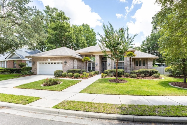 view of front of house featuring a front yard and a garage