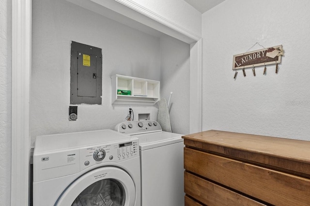 washroom featuring hookup for an electric dryer, hookup for a washing machine, and washing machine and clothes dryer