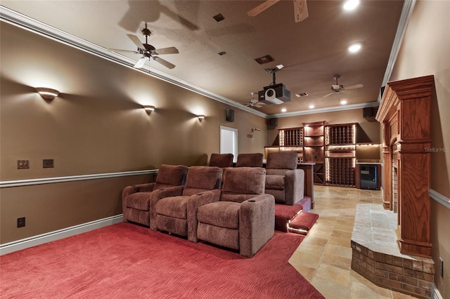 cinema room featuring ornamental molding and ceiling fan