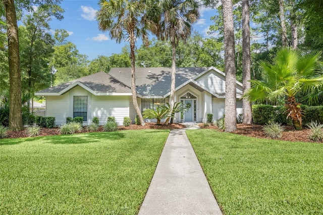 ranch-style house featuring a front yard