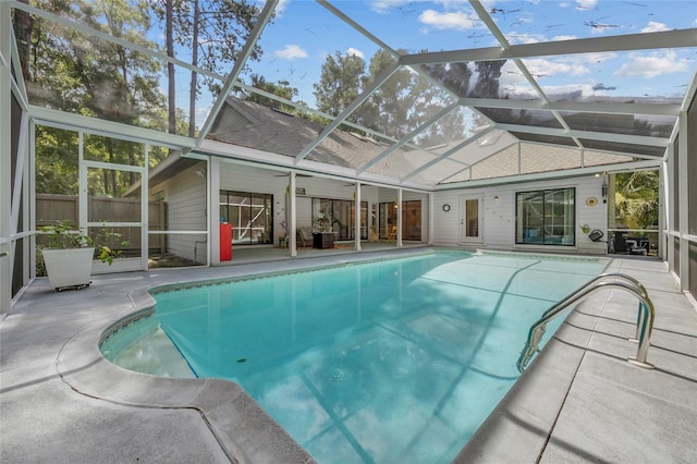 view of pool featuring a patio and glass enclosure