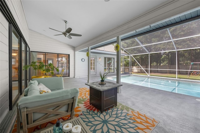 interior space featuring ceiling fan, plenty of natural light, lofted ceiling, and a pool