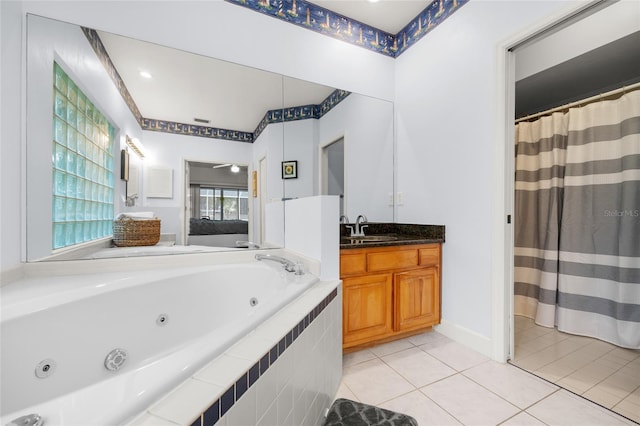 bathroom featuring tile patterned floors, ceiling fan, vanity, and a relaxing tiled tub