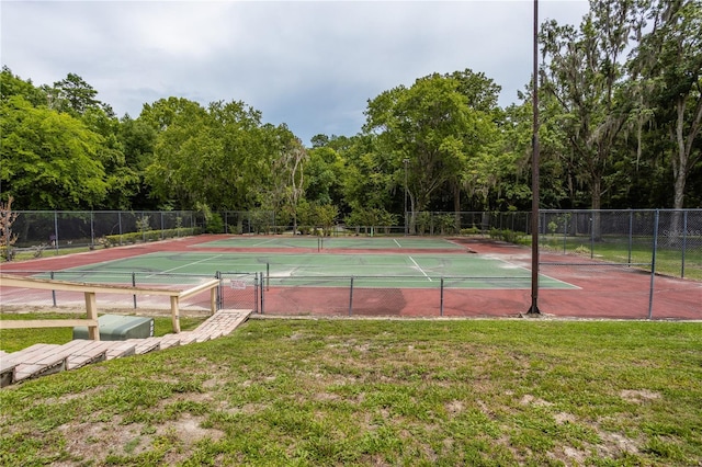 view of sport court featuring a yard