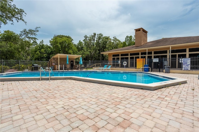 view of swimming pool with a patio area