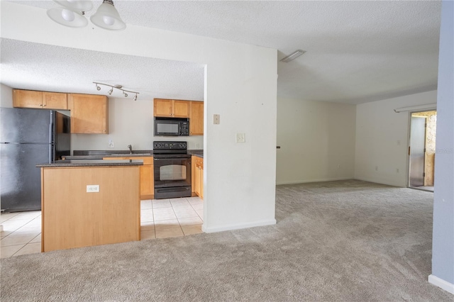 kitchen with light carpet, sink, a center island, a textured ceiling, and black appliances