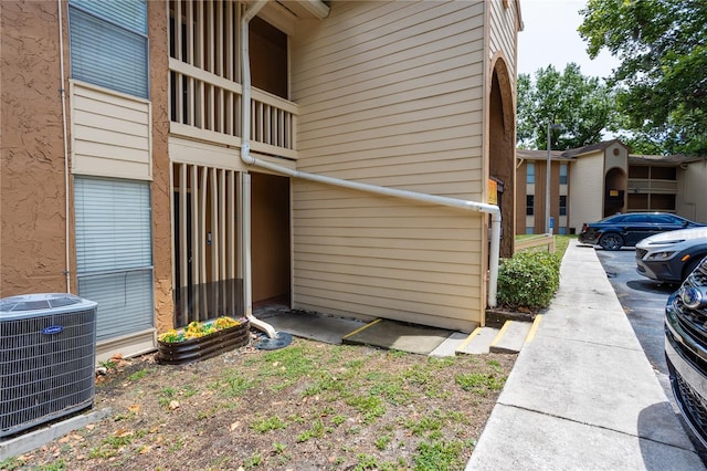 view of side of home featuring central air condition unit