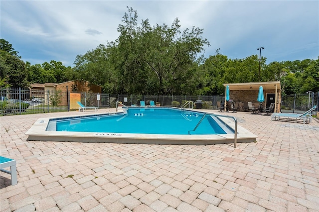 view of pool featuring a patio