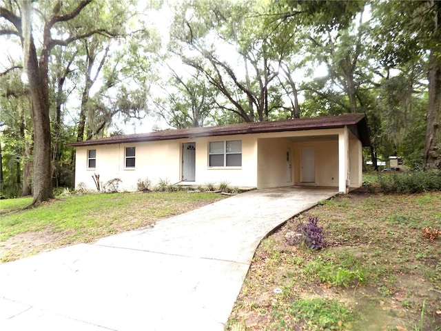 ranch-style house with a carport