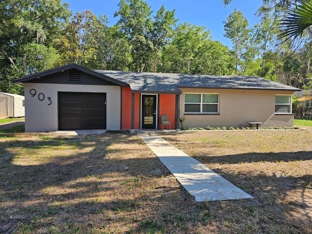 ranch-style house featuring a garage