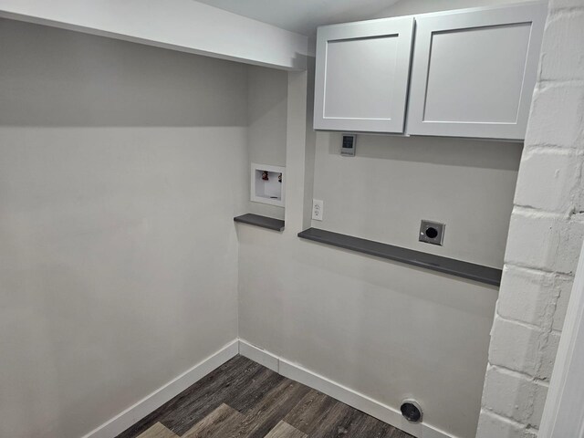 laundry area featuring electric dryer hookup, cabinet space, baseboards, hookup for a washing machine, and dark wood-style flooring