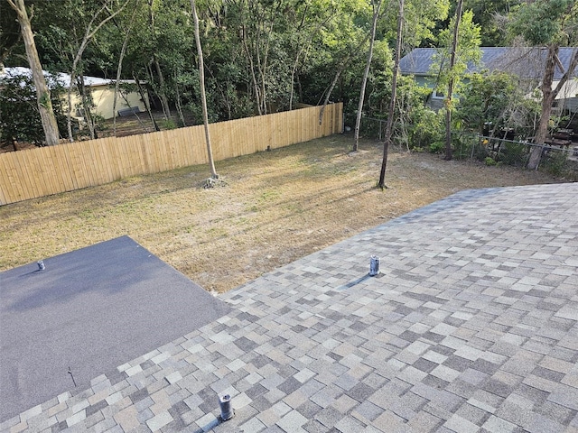 view of yard featuring a patio and fence