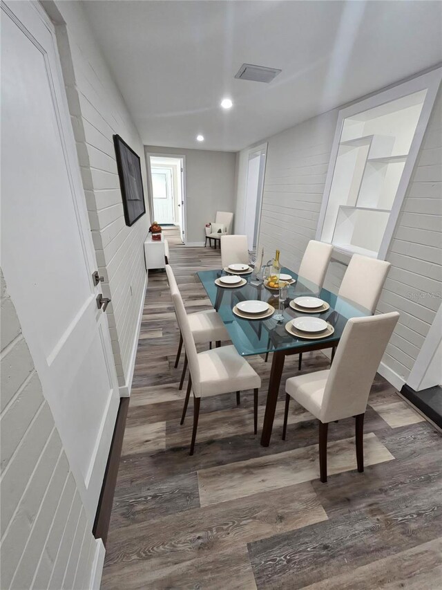 dining space with dark wood-type flooring