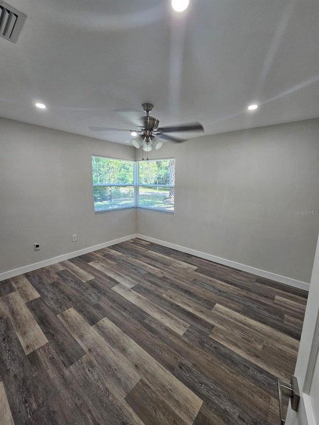 spare room with visible vents, baseboards, ceiling fan, recessed lighting, and dark wood-style floors