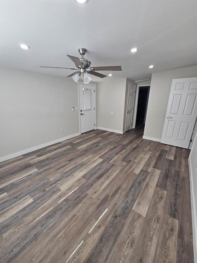 empty room featuring recessed lighting, baseboards, dark wood-style flooring, and ceiling fan