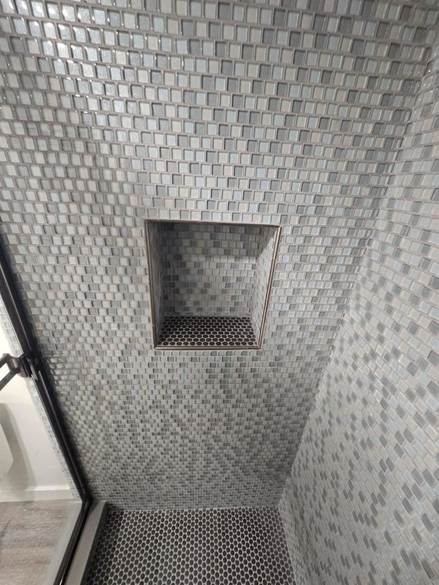 room details featuring a shower with shower door