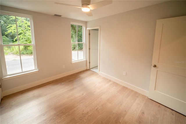 unfurnished room featuring ceiling fan and light wood-type flooring