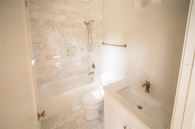 full bathroom featuring vanity, toilet, and tiled shower / bath combo