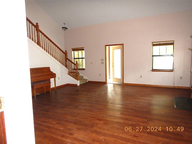 entryway with dark hardwood / wood-style floors and a wealth of natural light