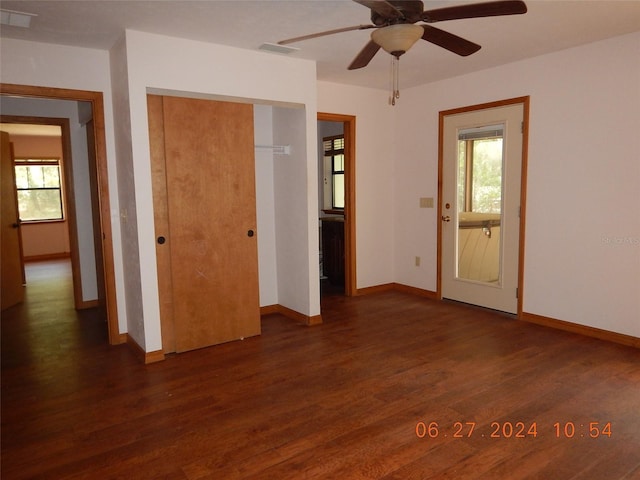 spare room with ceiling fan and dark hardwood / wood-style floors