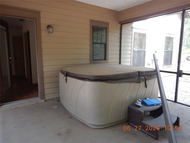 view of patio with a hot tub