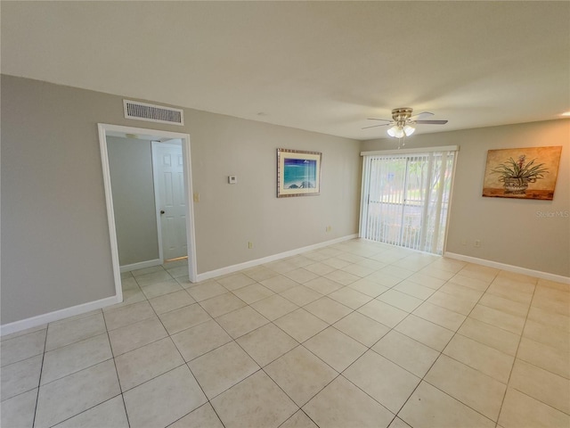 unfurnished room featuring light tile patterned flooring and ceiling fan