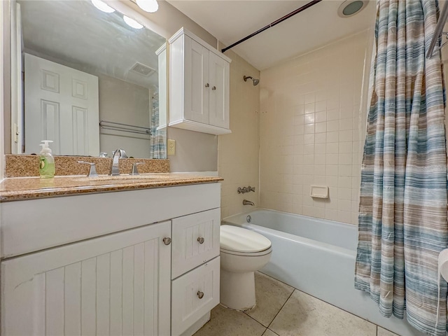 full bathroom with tile patterned floors, toilet, shower / tub combo, and vanity