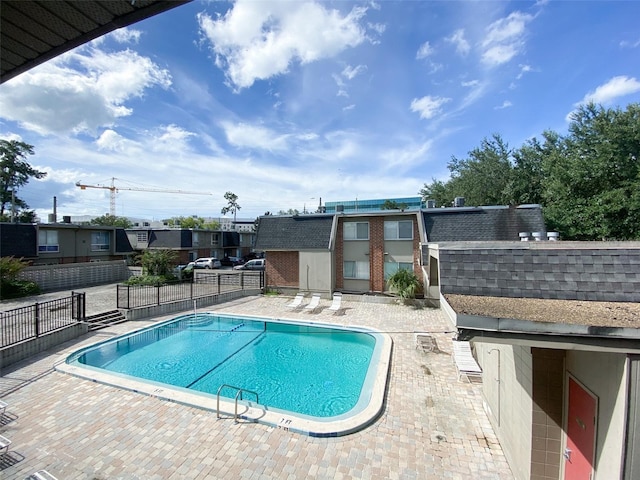 view of swimming pool featuring a patio area