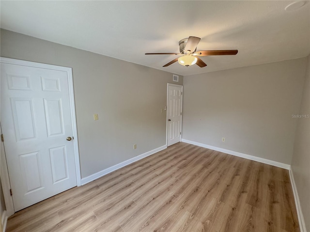 unfurnished room featuring ceiling fan and light wood-type flooring