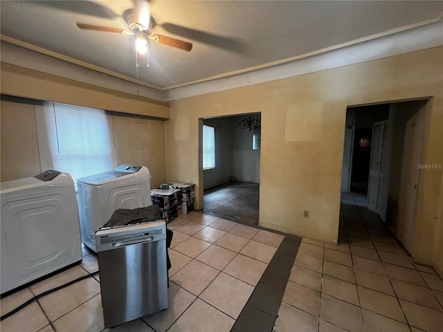 clothes washing area featuring light tile patterned floors, independent washer and dryer, and ceiling fan