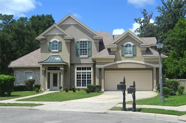 view of front facade featuring a garage and a front yard