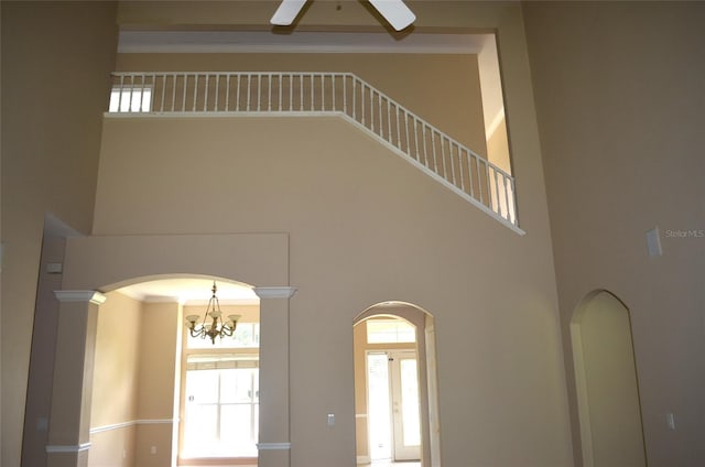 room details with ceiling fan with notable chandelier