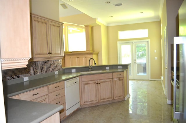 kitchen with light tile patterned flooring, decorative backsplash, sink, white dishwasher, and french doors