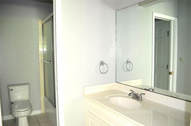 full bathroom with vanity, toilet, combined bath / shower with glass door, and tile patterned flooring