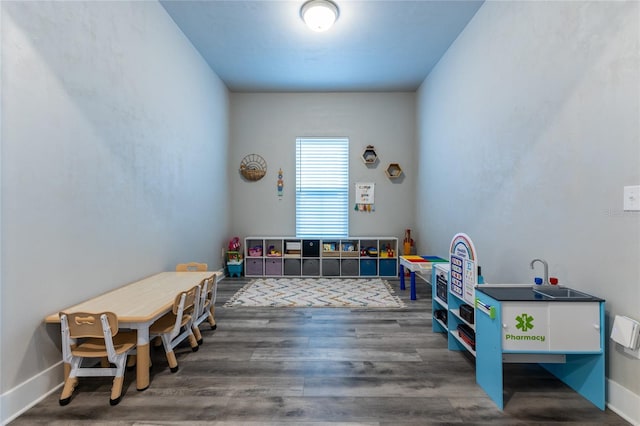 recreation room featuring dark wood-type flooring